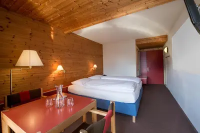 Ein Bett oder Betten in einem Zimmer der Unterkunft Hotel Panorama