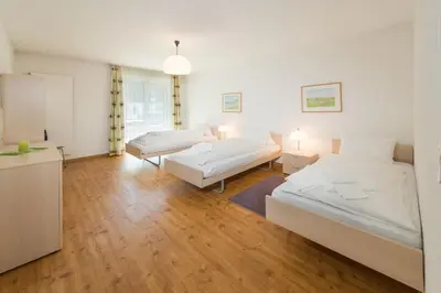 Ein Bett oder Betten in einem Zimmer der Unterkunft Postgebäude