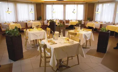 Ein Restaurant oder anderes Speiselokal in der Unterkunft Hotel Jungfrau Mürren