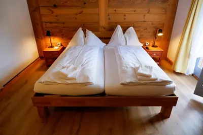 Ein Bett oder Betten in einem Zimmer der Unterkunft Hotel Christiania Saas-Fee