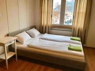 Ein Bett oder Betten in einem Zimmer der Unterkunft Interlaken Marco Hostel