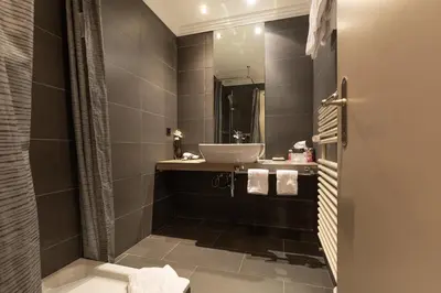 Ein Badezimmer in der Unterkunft Hotel Central, SPA & LOUNGE BAR