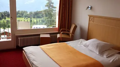Ein Bett oder Betten in einem Zimmer der Unterkunft Hôtel Splendide