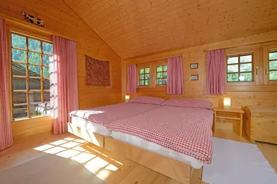 Ein Bett oder Betten in einem Zimmer der Unterkunft Chalet Tuk-Tuk