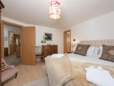 Ein Bett oder Betten in einem Zimmer der Unterkunft Chez Nous Zermatt