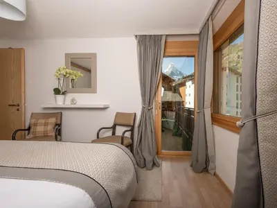 Ein Bett oder Betten in einem Zimmer der Unterkunft Chez Nous Zermatt