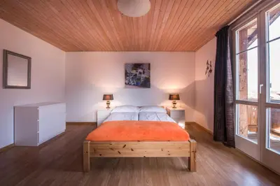Ein Bett oder Betten in einem Zimmer der Unterkunft Chalet Cecile