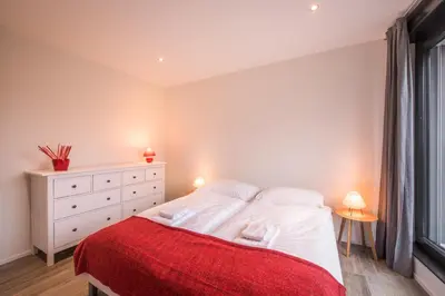 Ein Bett oder Betten in einem Zimmer der Unterkunft Independance Penthouse
