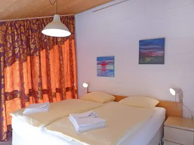Ein Bett oder Betten in einem Zimmer der Unterkunft Apartment Im Gruebi Apt- 10 by Interhome
