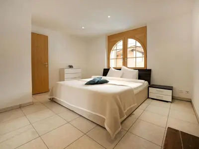 Ein Bett oder Betten in einem Zimmer der Unterkunft Apartment La Prairie by Interhome