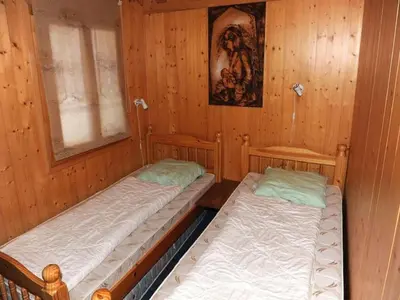 Ein Bett oder Betten in einem Zimmer der Unterkunft wooden chalet in Betten near the Aletsch Arena