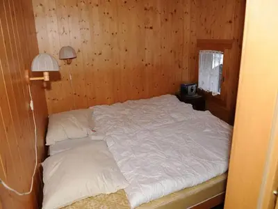 Ein Bett oder Betten in einem Zimmer der Unterkunft wooden chalet in Betten near the Aletsch Arena