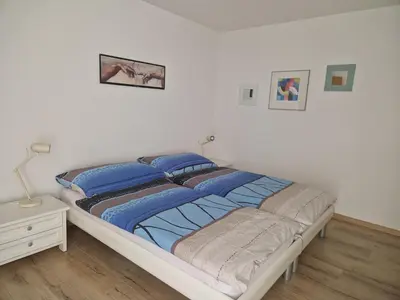 Ein Bett oder Betten in einem Zimmer der Unterkunft Sunnuhubil Leukerbad