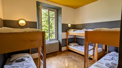Ein Bett oder Betten in einem Zimmer der Unterkunft Wild Valley Hostel - Villa Edera