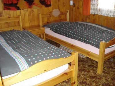 Ein Bett oder Betten in einem Zimmer der Unterkunft Chalet Alphütte