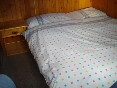 Ein Bett oder Betten in einem Zimmer der Unterkunft Chalet Alphütte