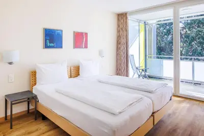 Ein Bett oder Betten in einem Zimmer der Unterkunft Hapimag Ferienwohnungen Interlaken