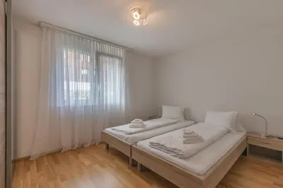 Ein Bett oder Betten in einem Zimmer der Unterkunft Mönch Apartment - Aare Jungfrau AG