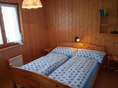 Ein Bett oder Betten in einem Zimmer der Unterkunft Chalet Silberdistel