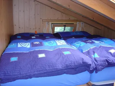 Ein Bett oder Betten in einem Zimmer der Unterkunft Ferienwohnung Stalden
