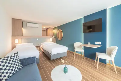 Ein Bett oder Betten in einem Zimmer der Unterkunft Hotel-Restaurant Seegarten-Marina
