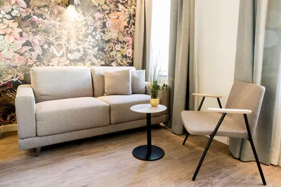 Ein Sitzbereich in der Unterkunft Adaastra Boutique Hotel