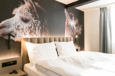 Ein Bett oder Betten in einem Zimmer der Unterkunft Adaastra Boutique Hotel