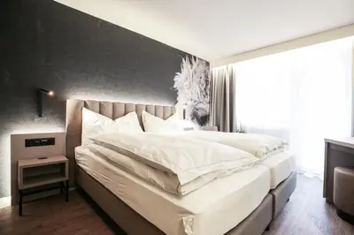 Ein Bett oder Betten in einem Zimmer der Unterkunft Adaastra Boutique Hotel