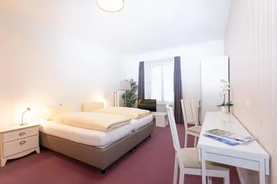 Ein Bett oder Betten in einem Zimmer der Unterkunft Hotel Landhaus Adler