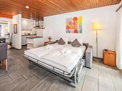 Ein Bett oder Betten in einem Zimmer der Unterkunft Apartment Chalet Almis-Bödeli-2 by Interhome