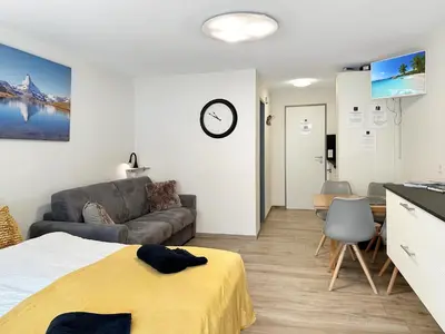 Ein Bett oder Betten in einem Zimmer der Unterkunft Phoenix Studio - Haus Astral - Zermatt
