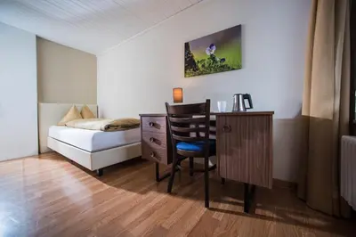 Ein Bett oder Betten in einem Zimmer der Unterkunft Jungfrau Hotel