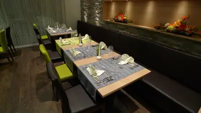 Ein Restaurant oder anderes Speiselokal in der Unterkunft Hotel Astoria
