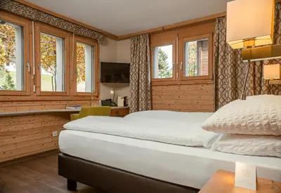 Ein Bett oder Betten in einem Zimmer der Unterkunft Hotel Landhaus