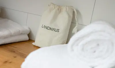 Ein Bett oder Betten in einem Zimmer der Unterkunft Hotel Landhaus
