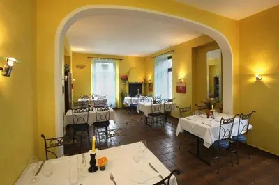 Ein Restaurant oder anderes Speiselokal in der Unterkunft Unione