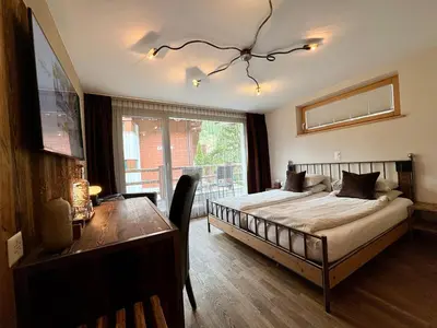 Ein Bett oder Betten in einem Zimmer der Unterkunft Alpenlodge