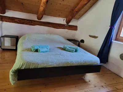 Ein Bett oder Betten in einem Zimmer der Unterkunft Casa Poiana