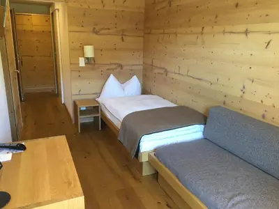 Ein Bett oder Betten in einem Zimmer der Unterkunft Hotel Bettmerhof
