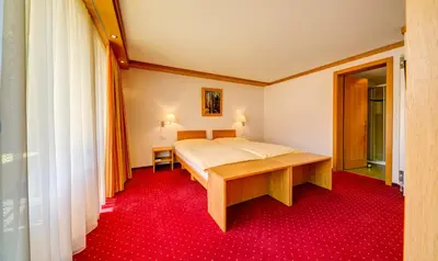 Ein Bett oder Betten in einem Zimmer der Unterkunft Hotel Excelsior