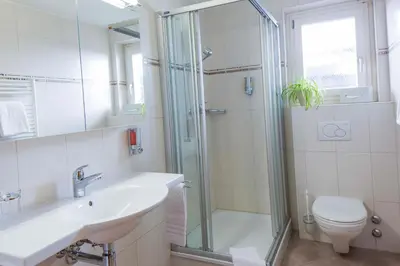 Ein Badezimmer in der Unterkunft Hotel Excelsior