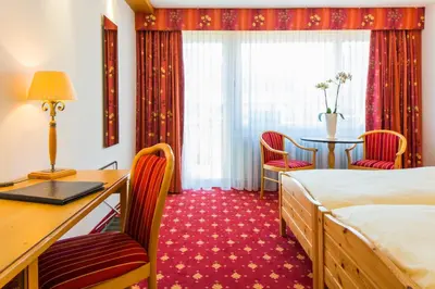 Ein Bett oder Betten in einem Zimmer der Unterkunft Hotel Excelsior