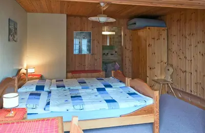 Ein Bett oder Betten in einem Zimmer der Unterkunft Chemihütte