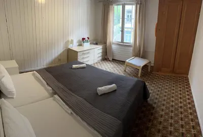 Ein Bett oder Betten in einem Zimmer der Unterkunft BASE Cafe