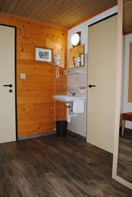 Ein Badezimmer in der Unterkunft Hotel Des Alpes