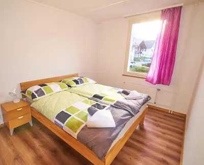 Ein Bett oder Betten in einem Zimmer der Unterkunft New West Station