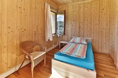 Ein Bett oder Betten in einem Zimmer der Unterkunft BerglandHof Hotel Ernen