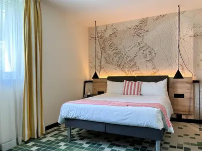 Ein Bett oder Betten in einem Zimmer der Unterkunft Nonanteneuf appart hōtel Sierre - contactless check-in