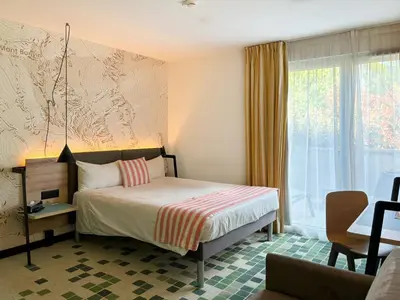 Ein Bett oder Betten in einem Zimmer der Unterkunft Nonanteneuf appart hōtel Sierre - contactless check-in