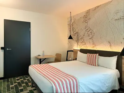 Ein Bett oder Betten in einem Zimmer der Unterkunft Nonanteneuf appart hōtel Sierre - contactless check-in